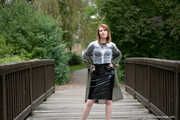 Miss Petra in a hot vinyl skirt, high heels and transparent blouse at photo shooting