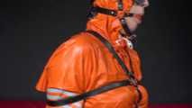 Sexy Pia wearing an oldschool orange shiny nylon rain pants and rain jacket being tied and gagged with belts and a ballgag on a chair (Video)