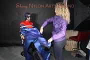 Watching Pia wearing a supersexy shiny nylon rainwear sitting on a hairdresser´s chair being tied and gagged with ropes, eye patches and a ballgag  (Pics)