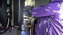 Watching sexy Sonja being tied and gagged overhead with ropes and a clothgag from a female rigger both wearing sexy shiny nylon rainwear (Video)