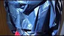 Sonja tied and gagged on a chair wearing a sexy red shorts and an oldschool rain jacket (Video)