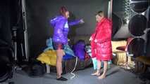 Watching sexy Stella and Sandra wearing a sexy shiny nylon shorts putting on several chiny nylon down jackets (Video)