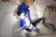 Sonja wearing a super sexy shiny nylon rain jacket and rain pants while taking a foam bath (Pics)