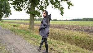 Miss Amira in blue Hunter rain jacket and patent leggings