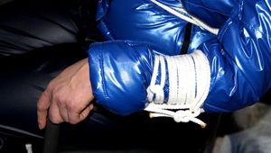 Simone tied and gagged in a shiny nylon down jacket