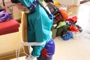 Mara tied and gagged and hooded on a chair wearing sexy shiny nylon shorts over a rainpants and a rain jacket (Pics)