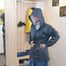 Miss Francine bound and gagged in layers of nylon raingear and a shiny silver Hotpants