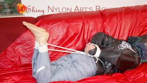 Sonja tied and gagged with ropes and a ball gag wearing a sexy grey shiny nylon rain pants and a black down jacket (Pics)