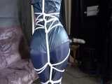 Watch Sonja enjoying Bondage in her shiny nylon Rainwear