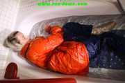 SEXY SONJA wearing a black shiny nylon rain pants and an orange big downjacket enjoying a bath (Pics)