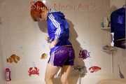 Sonja taking a shower wearing a very hot purple shiny nylon shorts and a blue rain jacket (Pics)