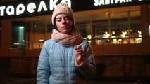 Lovely Russian girl Karina smokes a cigarette in the cold outside 