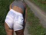 Watch Chloe taking a walk with her shiny nylon Shorts