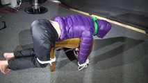 Watching Sonja wearig a sexy blue rainpant and a purple down jacket being tied, gagged and hooded on a stool with ropes and a cloth gag (Video)