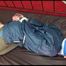 Jill tied, gagged and hooded on a princess bed in an old cellar wearing a shiny grey nylon pants and a shiny blue rain jacket (Video)