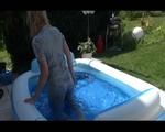 Pia lolling in the small swimmingpool wearing a sexy grey shiny nylon jumpsuit (Video)