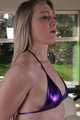 Sophie bound and gagged in a purple shiny wetlook Bikini