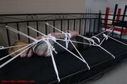 Extremly tied on the bed