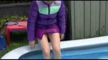 Watching Mara wearing a sexy short down skirt and a down jacket playing with water in the swimming pool (Video)