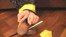 [From archive] Stella - taped sitting with yellow duct tape and packed into trash bag (video)