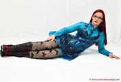 Nadja shows her short black pvc dress under a blue raincoat