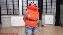 Handcuffed in life jacket