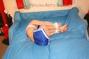 Wonderful archive girl tied and gagged on bed wearing a top and a shiny nylon shorts (Pics)