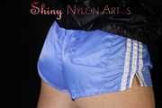 Watching sexy Sonja during her workout wearing sexy blue shiny nylon shorts and a darkblue rain jacket (Pics)
