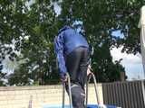 Watch Chloe cleaning the Pool in her shiny nylon Rainwear