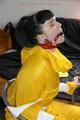 Jill tied and gagged on a chair wearing a yellow rainsuit and coveres with an yellow raincoat with two hoods (Pics)
