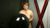 Naked with big black balloon
