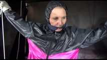 Mara tied, gagged and hooded overhead with ropes and a clothgag wearing a sexy rainwear combination (Video)