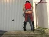 020054 Kathy Slips Away To Pee In Front Of A Garage Door