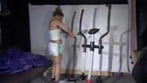 Watching sexy Sandra wearing a sexy shiny nylon shorts and a adidas top during her stretching and workout on the crosstrainer (Video)