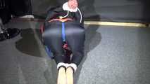 Sonja being tied, gagged and hooded on the floor with ropes and a clothgag wearing sexy shiny nylon rainwear and a lifevest (Video)