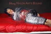 Sonja being tied, gagged and hooded with plastic wrap wearing a sexy shiny nylon rainwear combination (Pics)