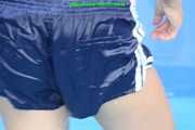 Watch Sandra cleaning the pool wearing a shiny nylon Shorts