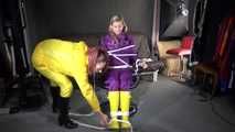 Watching sexy Sandra wearing hot purple shiny nylon rainwear with rubber boots being tied, gagged and hooded from Stella wearing a sexy yellow shiny nylon rainwear with high heels rubber boots (Video)