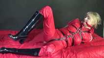 ***HOT***HOT***HOT***Mia wearing a sexy red shiny nylon jumpsuit and black shiny heel rubber boots being tied and gagged with belts and a clothgag (Video)