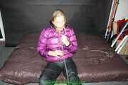 Watch Pia in her shiny nylon Downjacket doing Selfbondage with Handcuffs
