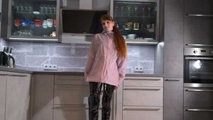 Miss Lara in Hunter rain jacket and vinyl catsuit bondage