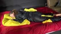 Sexy Sandra wearing sexy shiny nylon rainwear lolling in bed (Video)