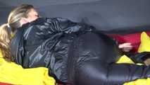 Sexy Sandra wearing sexy shiny nylon rainwear lolling in bed of nylon (Video)