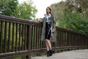 Miss Petra in a hot vinyl skirt, high heels and transparent blouse at photo shooting