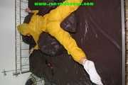 Get 687 Pictures with Stella tied and gagged in shiny nylon rainwear from 2005-2008!