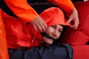 Julia tied and gagged by Alina in heavy raingear