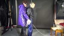 Watching sexy Sonja being tied and gagged overhead with ropes and a clothgag from a female rigger both wearing sexy shiny nylon rainwear (Video)