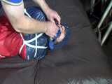 Watch Sandra hogtied and pantygagged in her shiny nylon Rainwear trying to free herself.