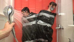 Anni Bay and Dakota - the pair in trash bags in the shower (video)