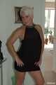 Blonde mature Claudia stipping out of a black dress